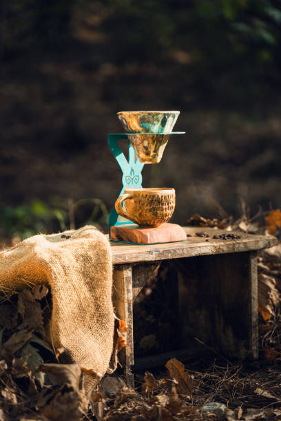 istock Ceramic Coffee Set with Filter and Mug on Wooden Table in Nature 2174110929