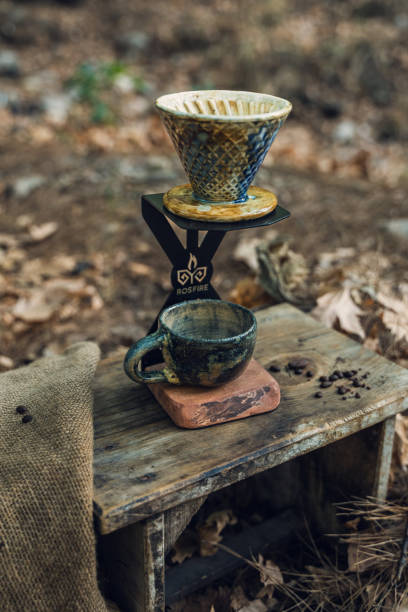 istock Ceramic Coffee Filter with Mug on Wooden Table in Nature 2174110993