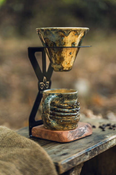 istock Ceramic Coffee Filter and Mug on Wooden Table 2174110997