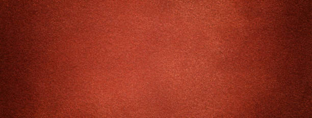 istock Dark brown and brick background from felt textile material with vignette. Structure of ginger suede velvet fabric 2174111167