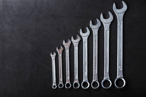istock Tool wrenches in a row on a black background with free space. 2174111861