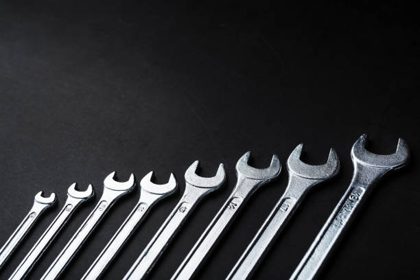 istock Tool wrenches in a row on a black background with free space. 2174111915