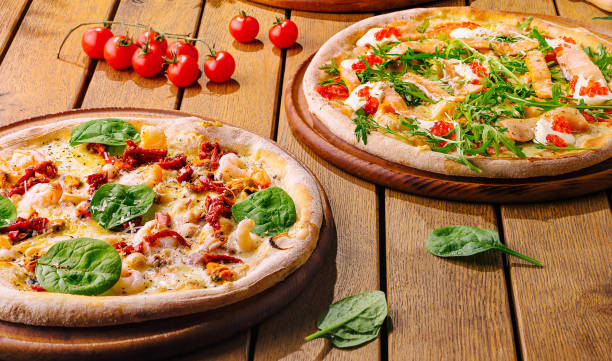 istock Gourmet italian pizzas on rustic wooden table 2174116612