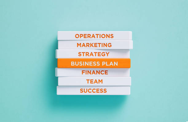 istock Business Plan Related Words Written Wood Blocks On Blue Background - Business Plan Concept 2174117536