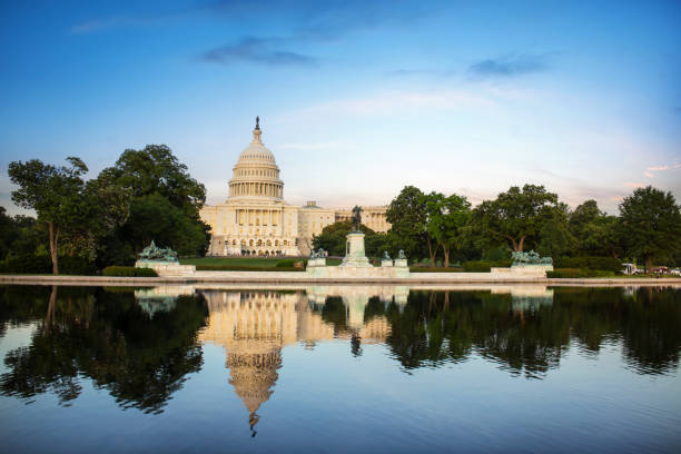 istock The United States Capitol building reflected on the reflection pool on a sunny day. 2174118746