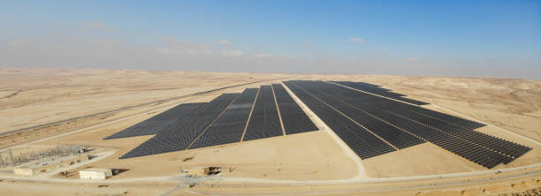 istock Solar panels power station desert aerial view 2174118859