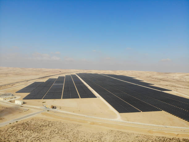 istock Solar panels power station desert aerial view 2174118930