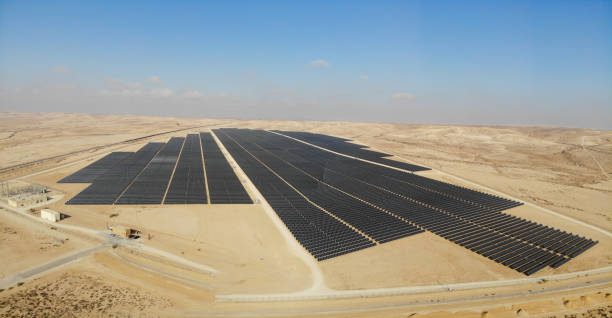 istock Solar panels power station desert aerial view 2174118955