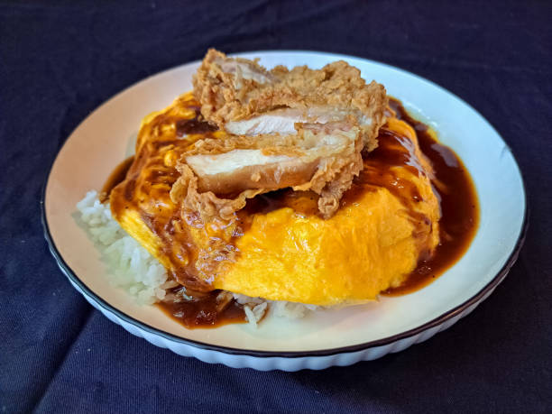 Chicken Egg Chiffon With Steamend Rice, Egg Chiffon, Omurice Sauce And Chicken Cutlet Caramelizend Onion. Food Menu.