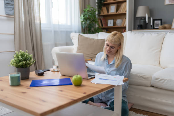 istock Side hustle money, second job concept. Young university student woman working freelance internet online job to pay student loan, saving money for rent, travel vacation. Finance and economy work. 2174120876
