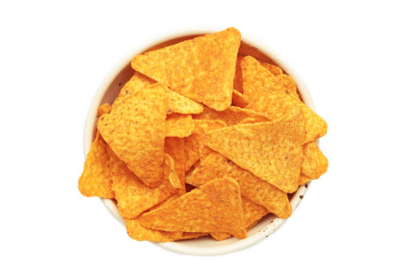istock Crispy corn tortilla nachos chips in bowl isolated on white background 2174131012