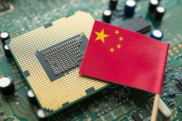 istock Chinese flag on CPU and green circuit board background. 2174131529