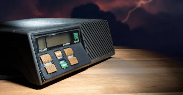istock Lightning striking behind a shotwave radio on a wood table 2174137842