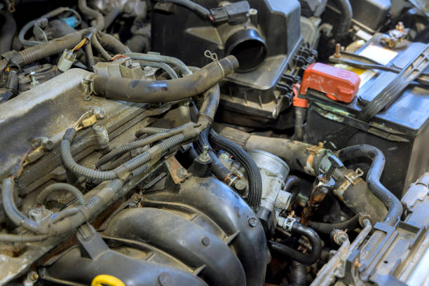 istock Auto mechanic working in auto garage, master repair service maintenance engine of a car 2174138023