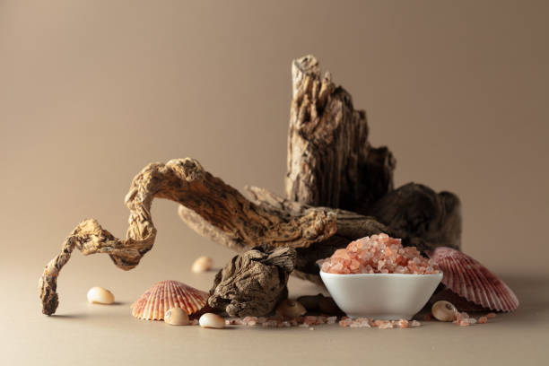 istock Pink himalayan salt with snags and seashells on a beige background. 2174138466