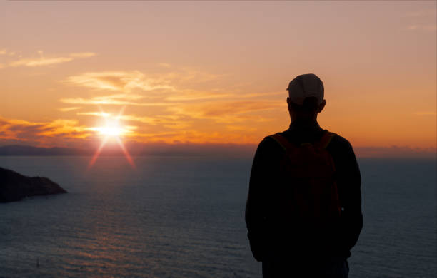Hiker on the Northern Way. Sunset on Mount Jaizkibel, Euskadi