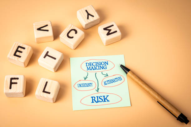 istock Decision Making Concept. Notepad and wooden alphabet letters on a light background 2174144883
