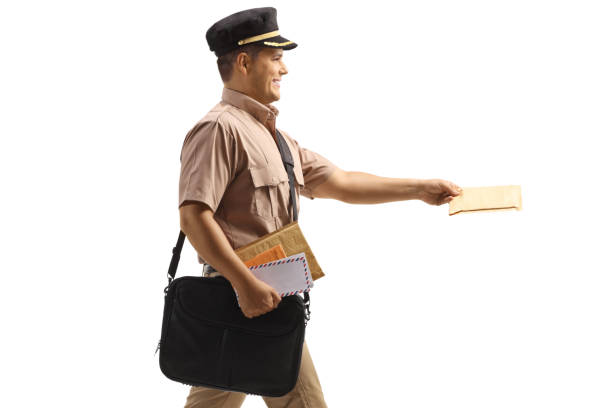 Profile shot of a mailman walking and delivering a letter isolated on white background