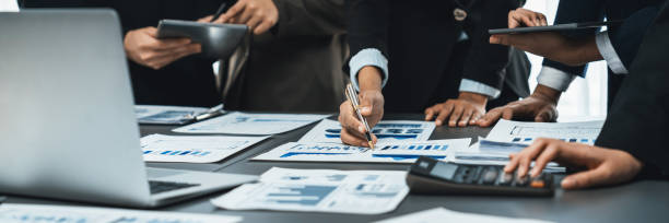 istock Modern office business people analyze business paper with calculator. Prodigy 2174145242