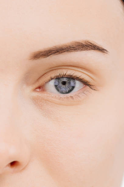 istock A close-up of a vibrant blue eye against a light background, evoking depth and expressiveness. This shot provides the perfect space for advertising, highlighting uniqueness and allure. 2174146406