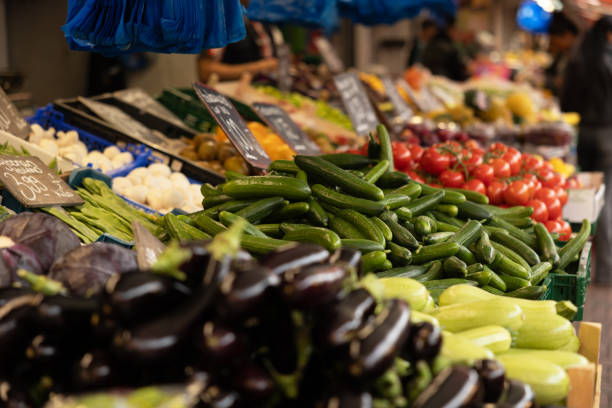 Close-up of cucumbers at a market stall. Haagse Market in The Hague, Netherlands. Vegetable, raw food, healthy nutrition.