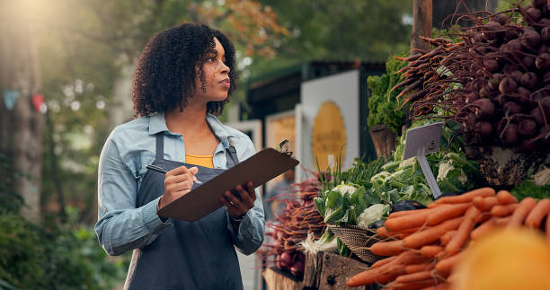 istock American worker writes information about goods on shelf on clipboard. 2174147303