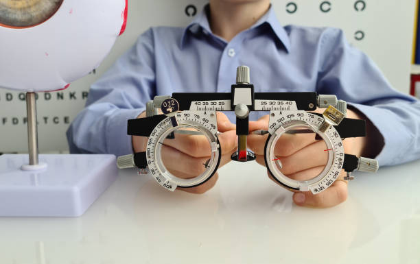 istock A child is seated in a clinical setting, holding a vision testing device used for eye examinations concept 2174148183