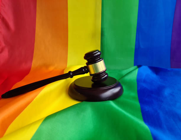 istock Gavel resting on a rainbow flag symbolizing support for LGBTQ rights during a legal discussion 2174148258