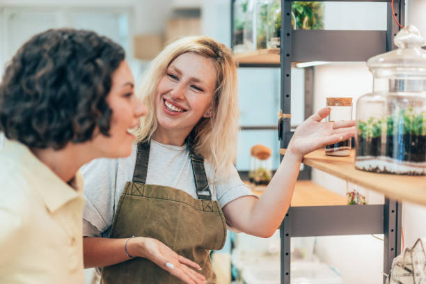 istock Beautiful flower shop owner  with client 2174148527