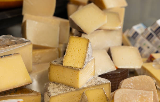istock Various types of cheese on sale at a market stall. 2174149449