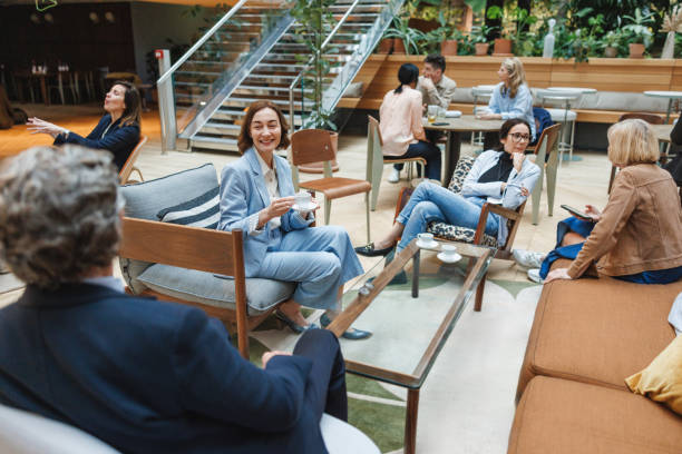 istock Diverse Executives Enjoying Coffee Break in Trendy Cafe 2174150478