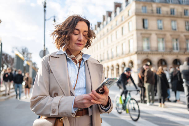 istock Confident Businesswoman Using Smartphone Outdoors 2174152388