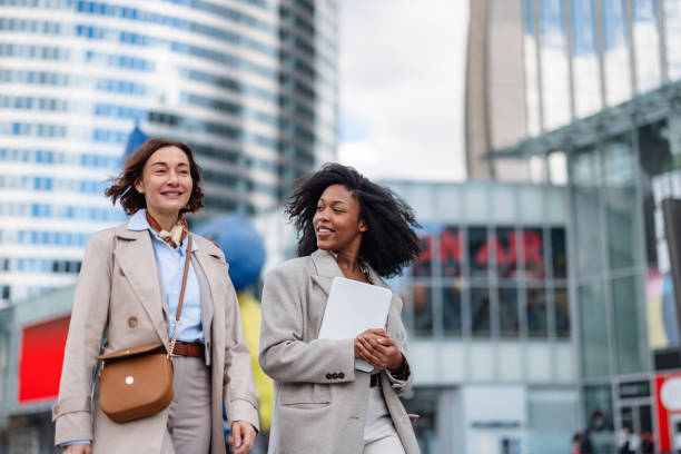 istock Ethnically Diverse Female Business Executives Walking In Urban District 2174152470