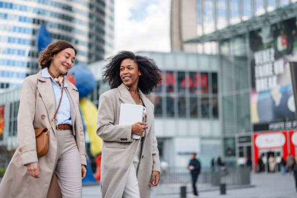 istock Caucasian And Black Female Executives Commuting Happily 2174152488