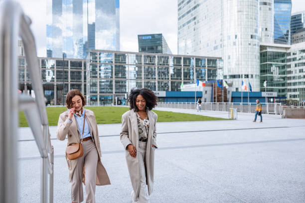 istock Smiling Female Executives Walking To Work In City 2174152594