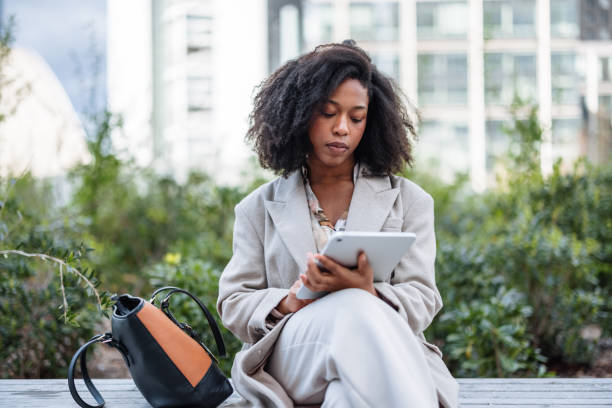istock Cheerful Black Businesswoman Using Digital Tablet Outside Office 2174152613