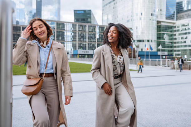 istock Two Female Executives Walking Energetically In City 2174152615