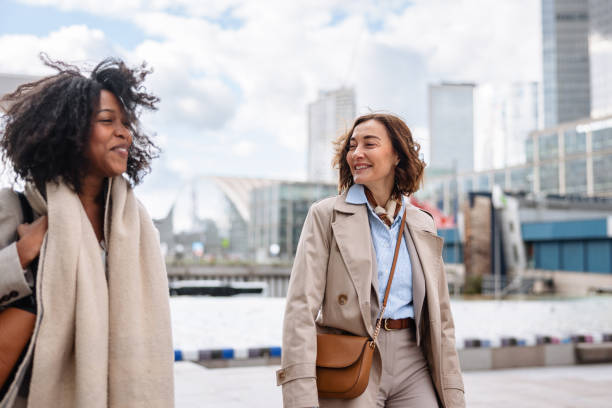 istock Smiling Businesswomen Walking Together 2174152627