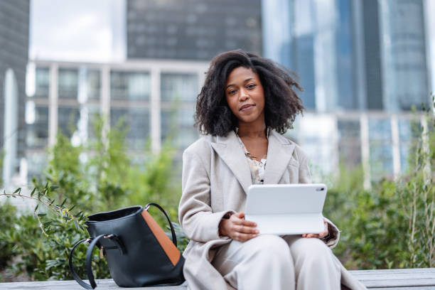 istock Cheerful Young Black Businesswoman Using Digital Tablet Outside Office 2174152660