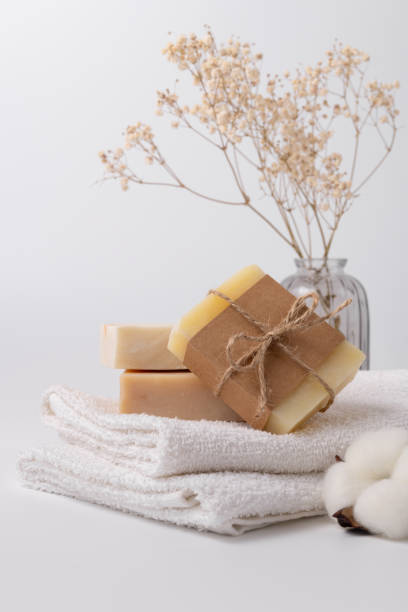 istock Natural, eco-friendly bath essentials featuring handmade soap bars and soft towels 2174155724