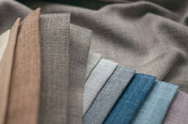 istock Brown and blue textured fabrics for curtains close-up, samples of fabrics for curtains 2174164531