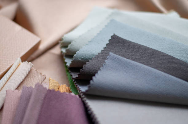 istock Purple, blue, gray and pink fabric samples for curtains. Fabric for curtains close-up 2174164707