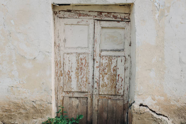 istock old wooden door in crumbling wall 2174167712