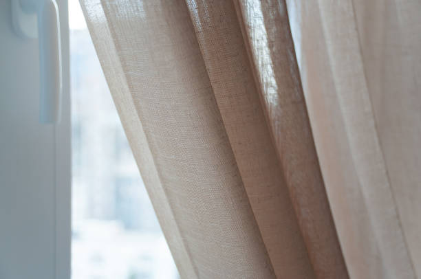 istock Linen curtains close-up. Light curtains of linen . 2174167713