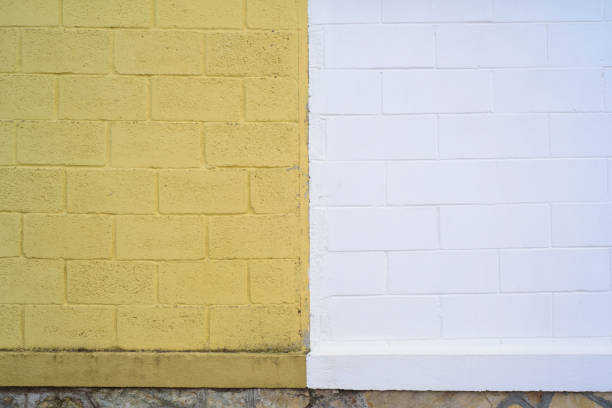White and yellow paint blocks wall outdoors