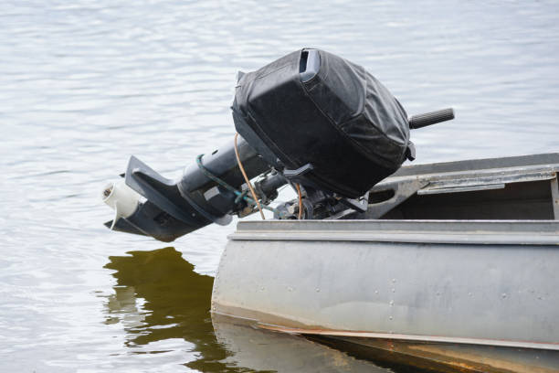 istock outboard motor on old wooden boat 2174168165