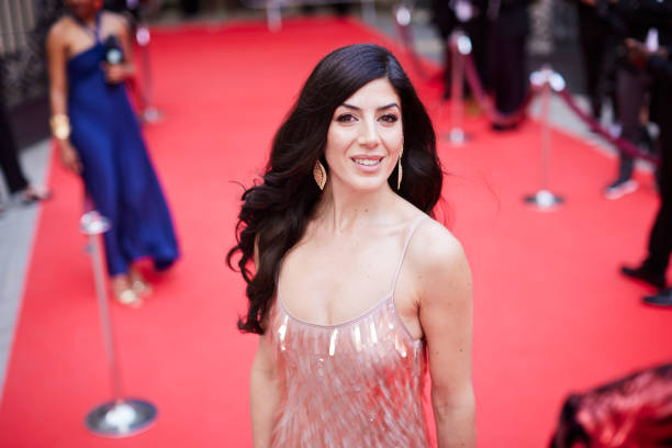 istock The Hispanic actress poses on the red carpet, looking directly at the camera. 2174169955