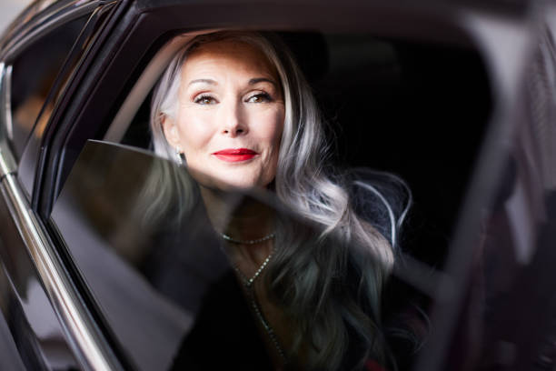 istock Looking out the limousine window, the actress appears eager with expectations, arriving at the red carpet event. 2174169992