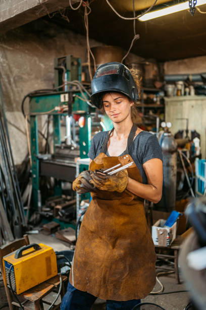 istock Young Female Welder In A Metal Workshop 2174170032