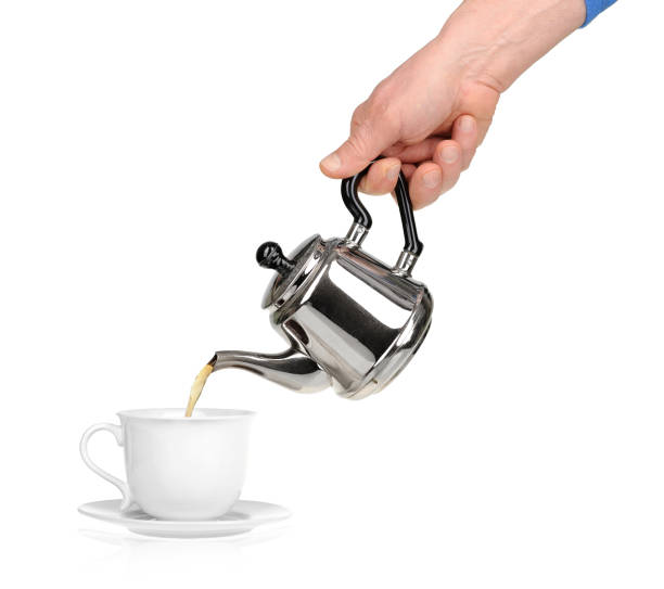 istock Pouring hot black tea from samovar metal teapot. 2174174562
